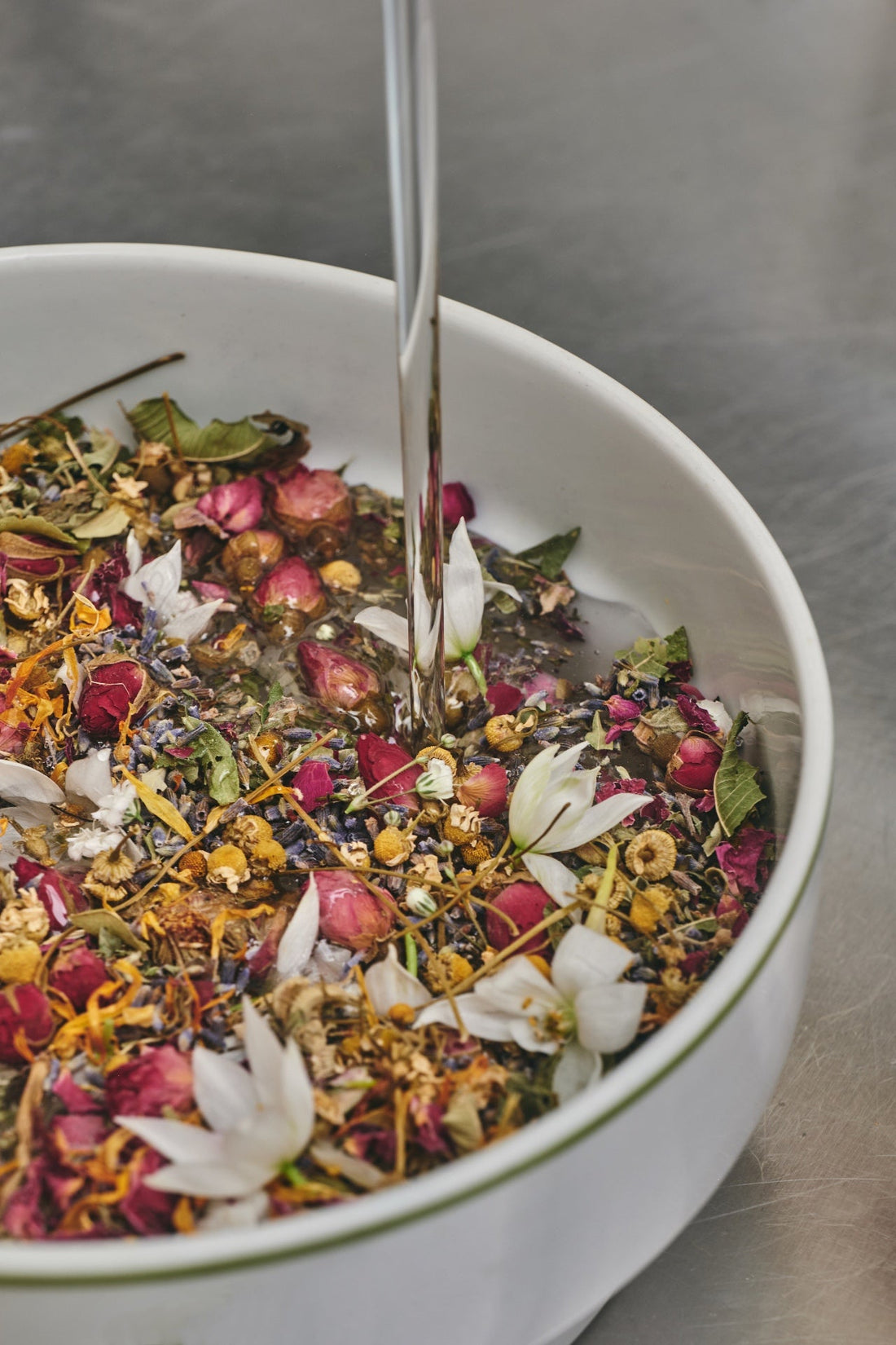 Botanical infusion jars steeping in the dark — the Ancient Amber™ steep at Ancient Nature