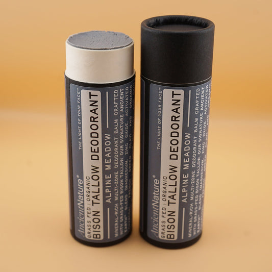 Two bison tallow deodorant sticks open and closed showing mineral-rich balm texture - Ancient Nature Alpine Meadow